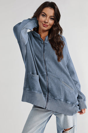 Waffle knit zip-through hoodie in blue with pockets and a relaxed fit.