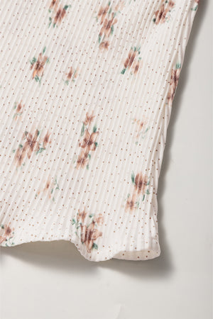 Pleated floral tank top with polka dots and a bow back detail.