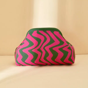 Vibrant knit clutch with striking pink and green wavy stripes