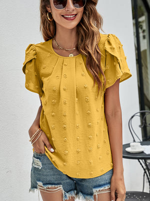Textured puff sleeve blouse in mustard with a dotted pattern and round neckline.
