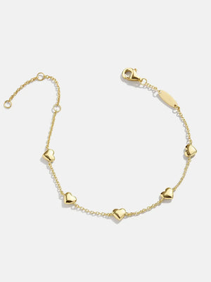 Gold chain bracelet with multiple heart charms