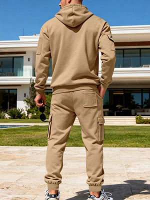 Men's camel cargo sweatpants and half-zip hoodie set with ribbed cuffs and pockets.