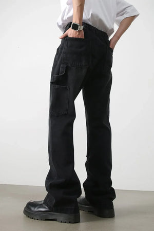 Dark wash denim wide leg carpenter jeans with utility pockets.