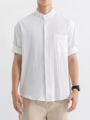 White relaxed fit button-up shirt with pocket and rolled sleeves