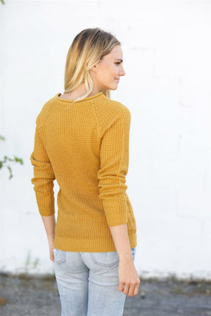 Yellow honeycomb knit pullover sweater with raglan sleeves and crew neck.