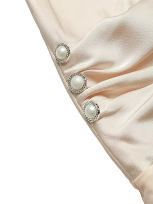 Elegant V-neck ruched bodysuit in champagne satin with pearl and rhinestone button details.