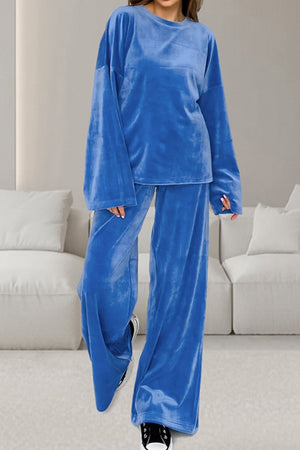 Blue velvet loungewear set with wide sleeve top and relaxed fit pants.