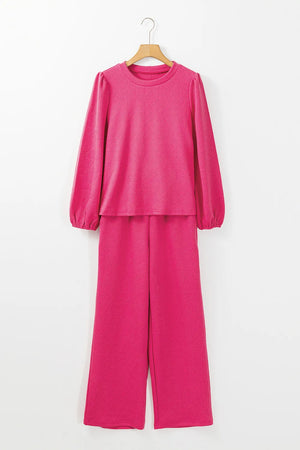 Textured puff sleeve lounge set in hot pink with a geometric pattern.
