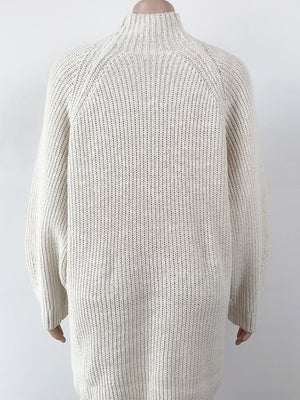 Cream ribbed knit cocoon turtleneck dress with long sleeves and a relaxed fit.