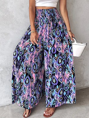 Bohemian print wide-leg pants with smocked waist in purple, pink, and blue