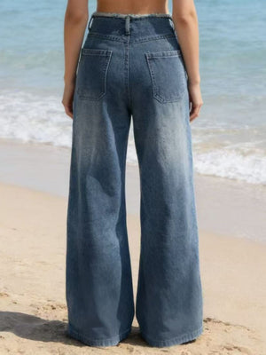 Blue denim maternity jeans with frayed hem and wide legs