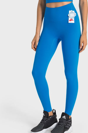 Blue seamless high-waist performance leggings with a Lycra tag.