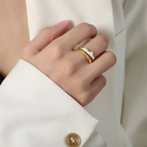 Sculpted Enamel Wave Ring in gold with white enamel detail, featuring a fluid, layered design.