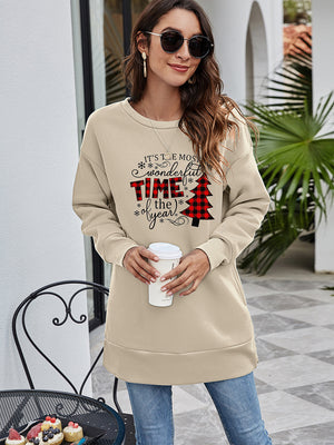 Beige tunic sweatshirt with "It's the most wonderful time of the year" holiday graphic and buffalo plaid Christmas tree.