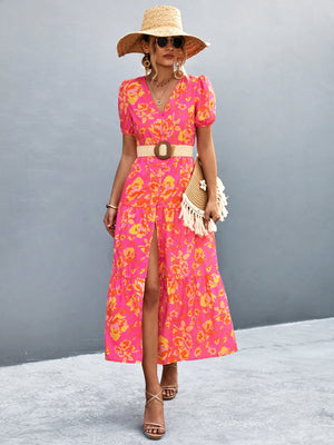 Floral print midi dress in hot pink with orange-red flowers, puff sleeves, V-neck, and button front.