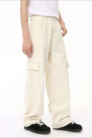 Ivory cargo pants with large side pockets, relaxed fit, and white stitching.