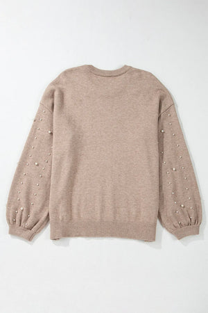 Dust Storm knit sweater with pearl embellished balloon sleeves and crew neck.