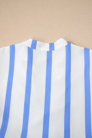 White and blue striped dress with a stand collar detail.