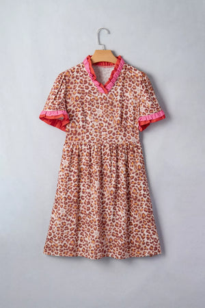 Leopard print dress with ruffled V-neck and short sleeves.