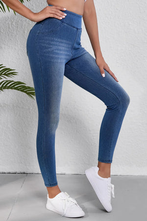 Denim-effect leggings in medium blue with a sculpted high rise and faux pocket details.
