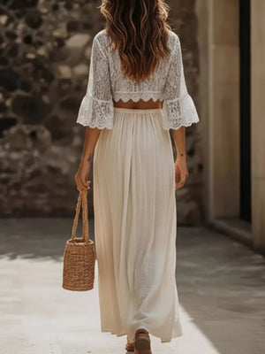 White lace crop top with bell sleeves and high slit skirt set