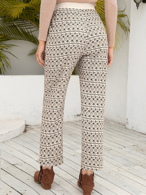 Geometric print drawstring cuff trousers in beige with black pattern, cropped length.