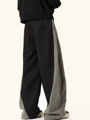 Men's black relaxed fit sweatpants with contrast grey side panels.