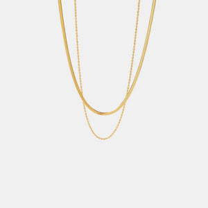 Gold serpentine and rope chain necklaces layered