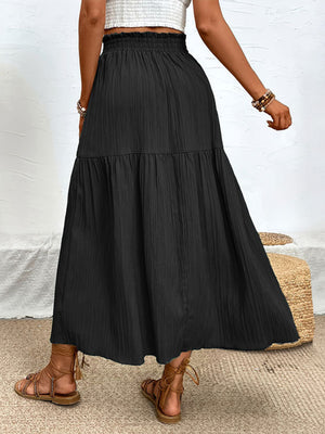 Black textured tiered maxi skirt with elastic waist and slit detail