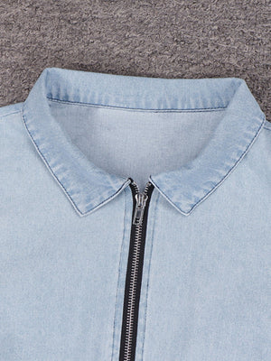 Light wash denim mini dress with collared neckline and front zipper detail.
