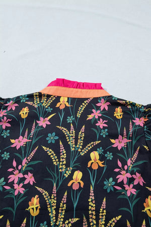 Vibrant floral print cotton blouse with contrast orange and pink ruffled collar.