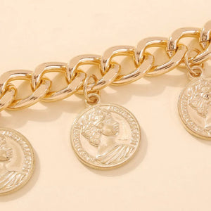 Chunky gold-plated chain bracelet with coin charms featuring a profile design.