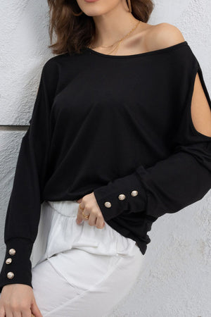 Black shoulder-slit top with button cuffs and a boat neckline.