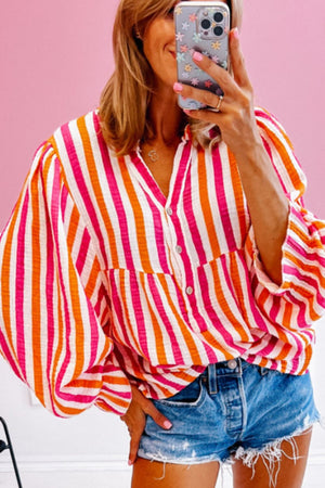 Textured stripe blouse in red with gathered balloon sleeves and button front.