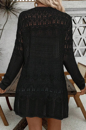 Black openwork crochet duster cardigan with long sleeves and intricate patterns.