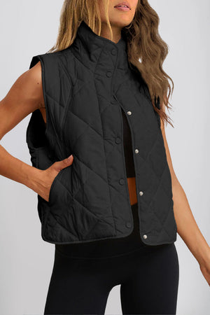 Black quilted stand collar vest with snap front and side pockets