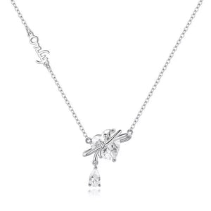 Silver necklace with a heart-shaped zircon pendant and a dangling pear-shaped zircon.
