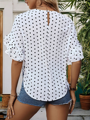 White polka dot blouse with ruffled sleeves and keyhole back detail.