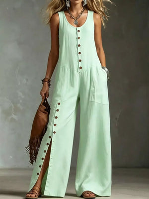 Green button-front wide-leg jumpsuit with side slits and pockets.