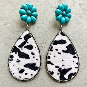 Turquoise petal stud earrings with black and white cowhide teardrop dangles.