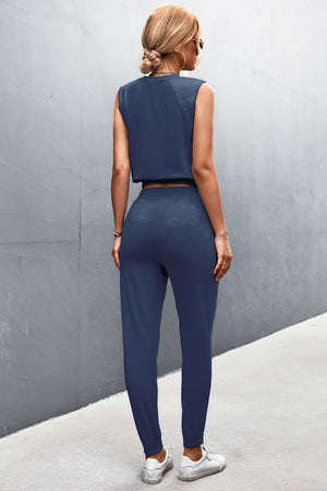 Navy cropped muscle tank and jogger set with cuffed ankles.