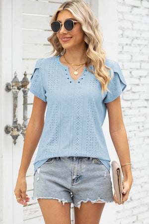 Light blue eyelet flutter sleeve top with V-neck and grommet detail.