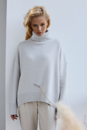 Light Gray oversized cashmere turtleneck sweater with ribbed cuffs and hem.