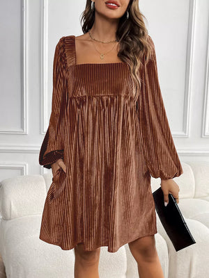 Brown velvet mini dress with square neckline, long puff sleeves, and pleated skirt.