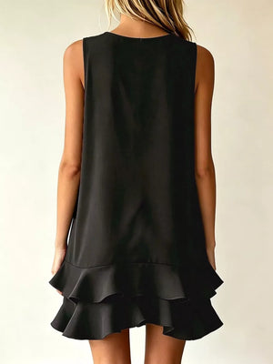 Black tiered ruffle mini dress with a sleeveless, A-line cut.