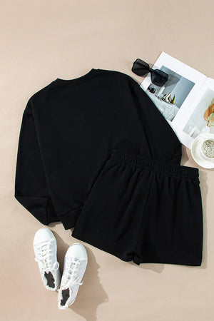 Black loungewear set with crewneck sweatshirt and elastic waist shorts.