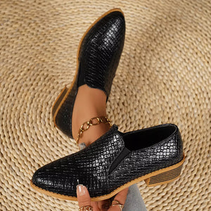 Black woven texture pointed loafers with block heels and elastic side panels.