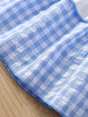 Blue gingham cotton cami and shorts set with ruffled trim.