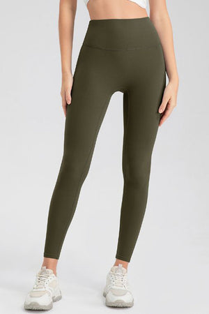 Olive green high-waist performance leggings with sculpting seams.