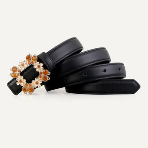 Black leather belt with ornate rhinestone-embellished buckle